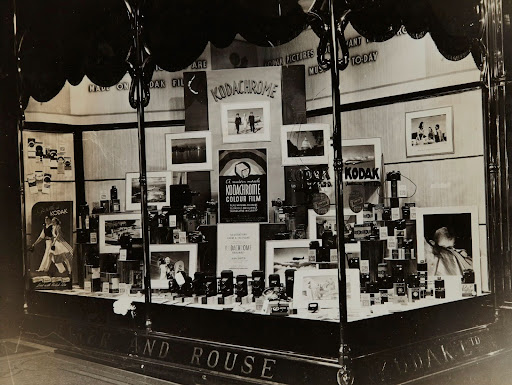 1930s storefront with a lavish Kodachrome display